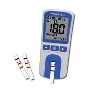 A palm held haemaglobin testing meter with 1 test strip inserted and another 2 positioned next to it